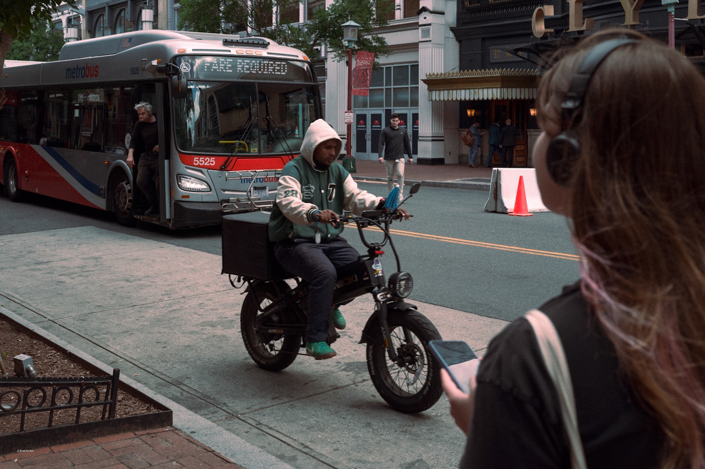 Delivery rider using an electric bike in the city
